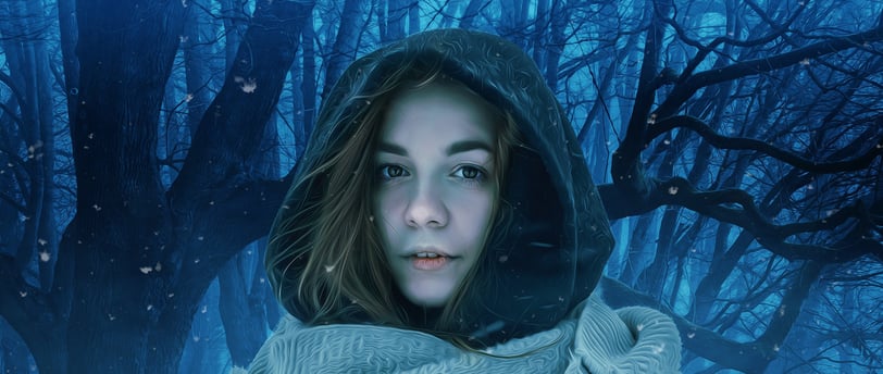 Hooded woman in blue-tinted forest