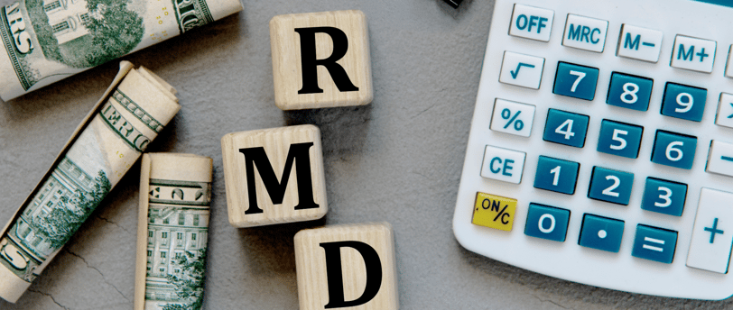 a calculator paperclip and money for required minimum distributions