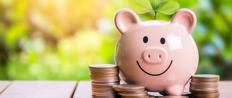 happy piggy bank with coins by it and a leaf sprouting on it for growth and wealth