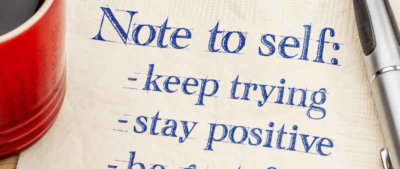 a notepad with a notepad and pen on a napkin