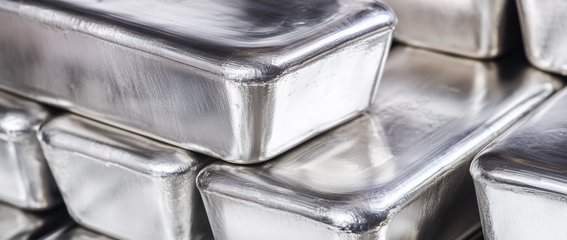 big silver bullion bars in stacks
