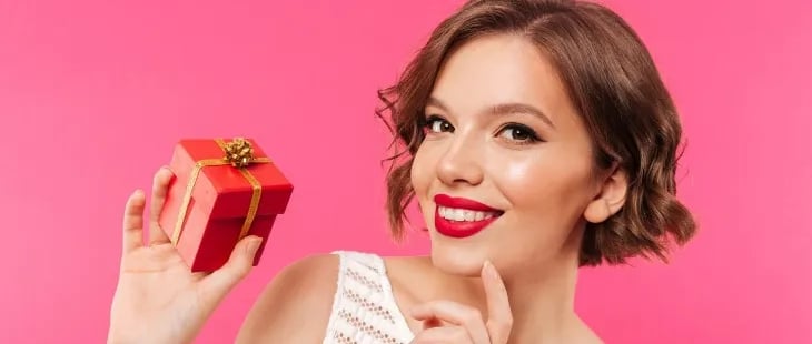 Smiling Woman with Christmas Present