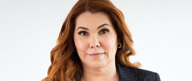 a woman in a suit and a black top