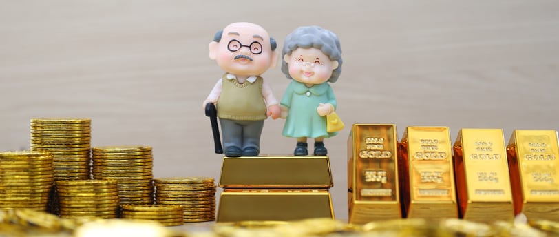 elderly couple with gold bars and coins for retirement