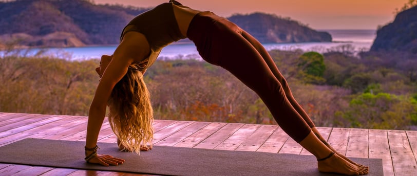 yoga pose with ocean view