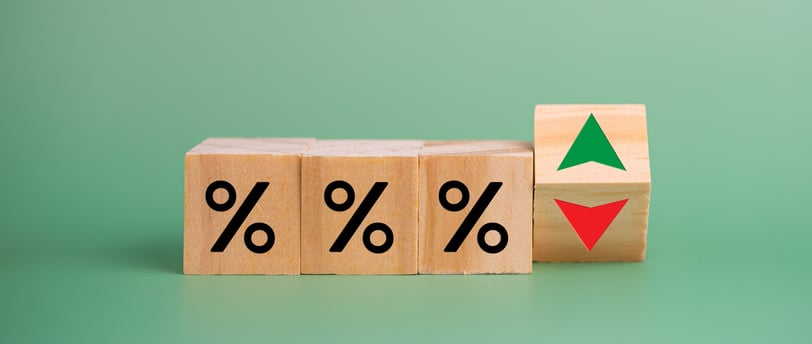interest rate symbols with a red arrow going down for rate cuts