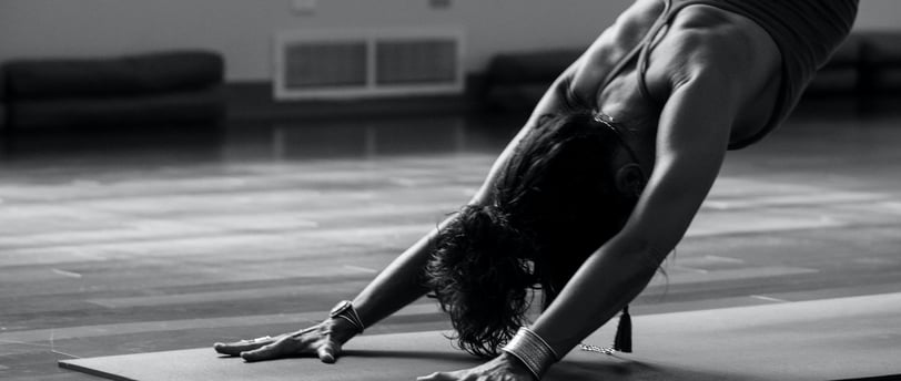 a woman doing a handstand yoga pose