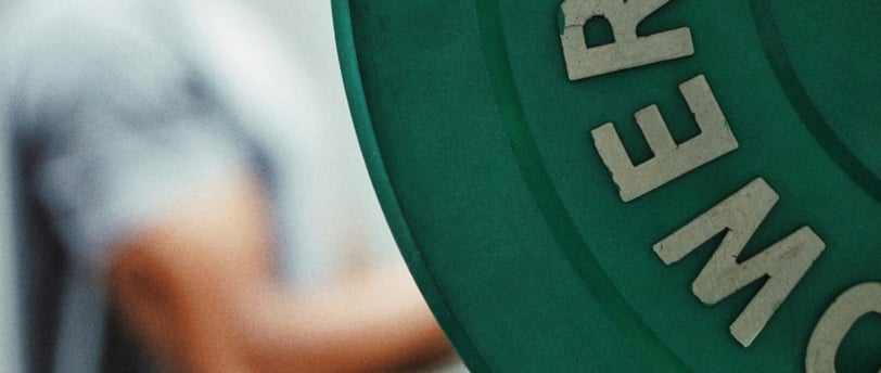 Man with weight in the background