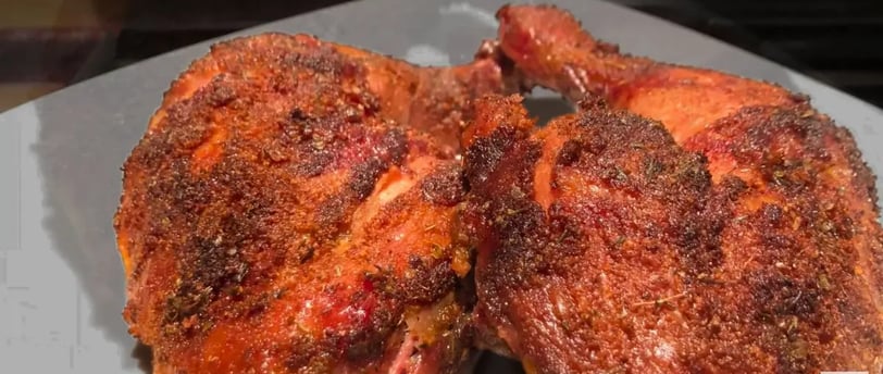 cajun grilled chicken on white plate
