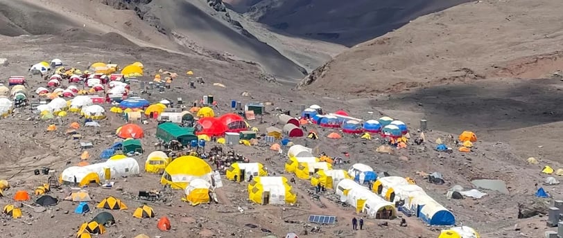 a mountain scene with tents and tents and tents
