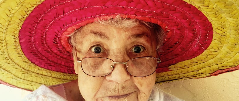 elderly woman with a colorful hat
