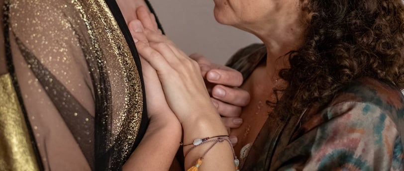 a man and woman holding hands in an embrace