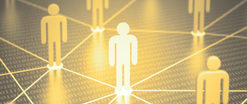 a group of people standing around a network of connected lines