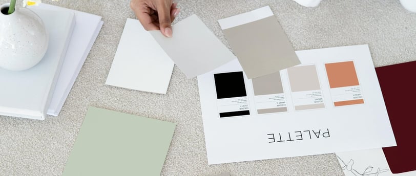 Someone viewing paint sample swatches