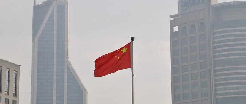 Chinese flag in front of buildings