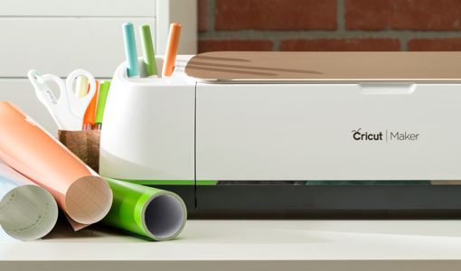 a cricut machine with a printer and some pens