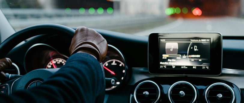 a rideshare driver driving a car with a tablet on the dashboard, what is ridesharing