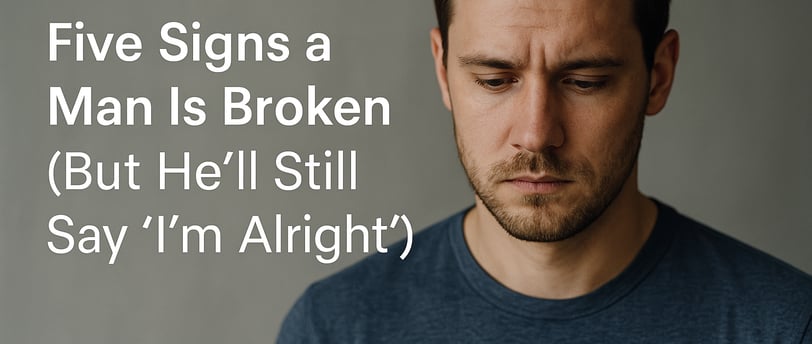 Reflective man in a blue shirt next to blog text about emotional signs men are silently struggling.