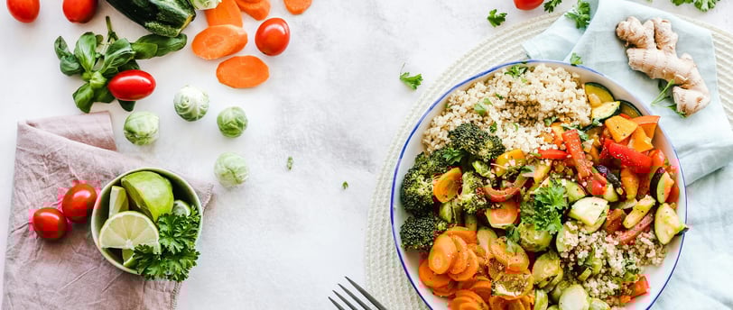 a plate of vegetables and vegetables on a table