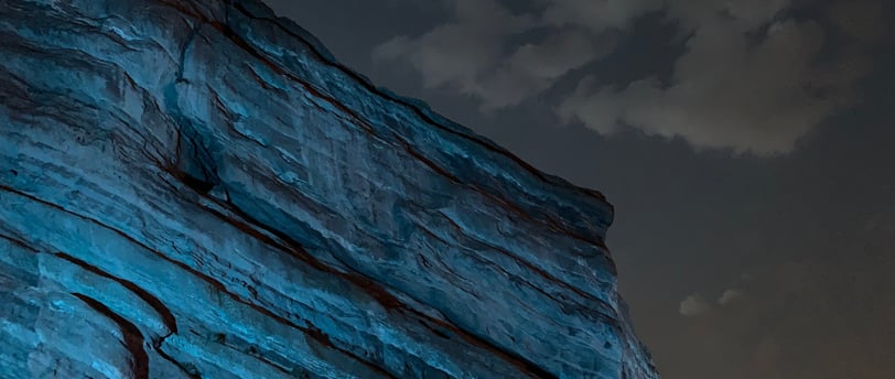 Red rocks in blue light at night
