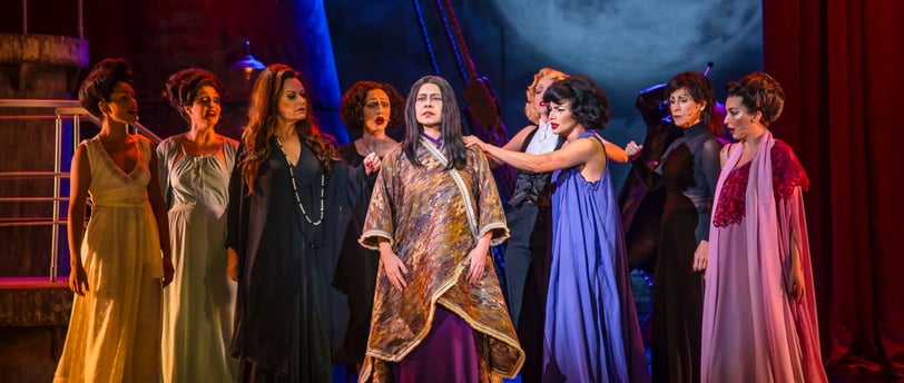 a group of people in costumes on stage