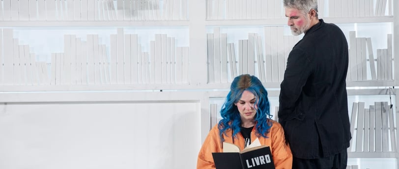 a man and woman in orange and black clothes