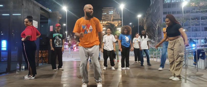 a man with a beard and a beard standing in a city