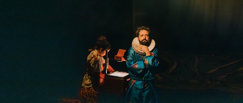 a man in a blue robe is holding a mirror