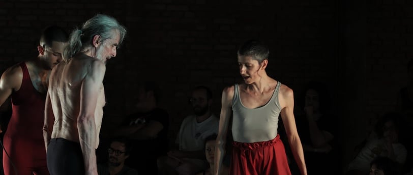 a man and woman performing a dance routine