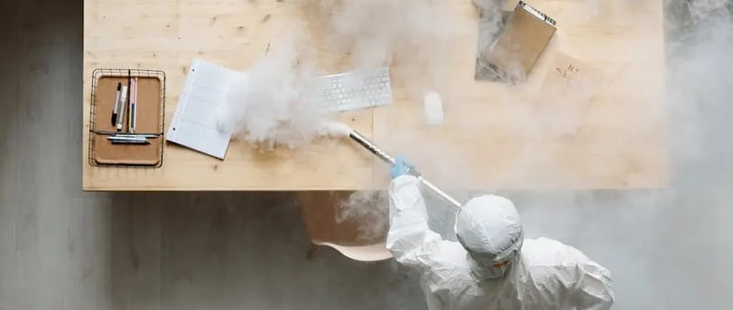 a person is sanitizing an office