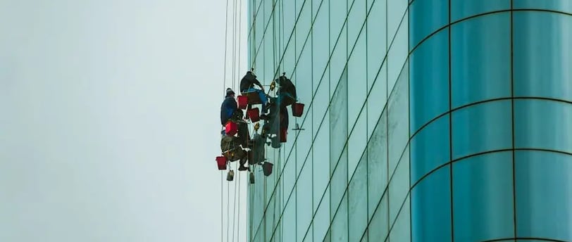 two workers cleaning a commercial building