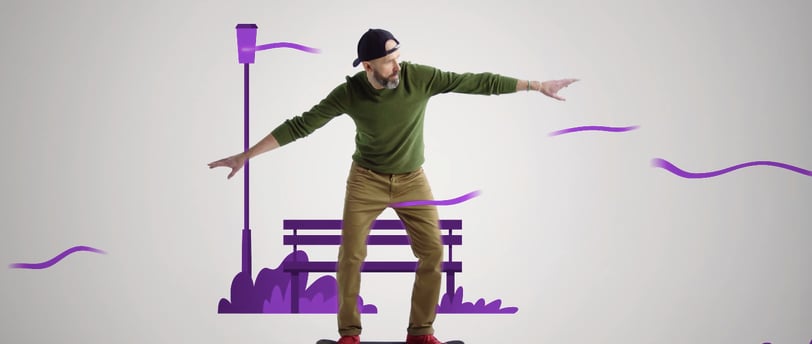a man in a green sweater skateboarding on a skateboard