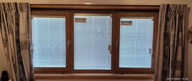 Integral blinds in uPVC window by Skill Construction