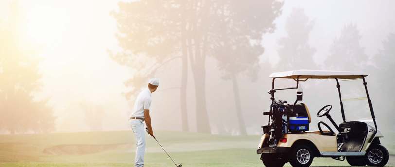 A man playing golf