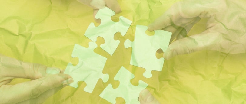 a group of people holding puzzle pieces of puzzle pieces - to show connection