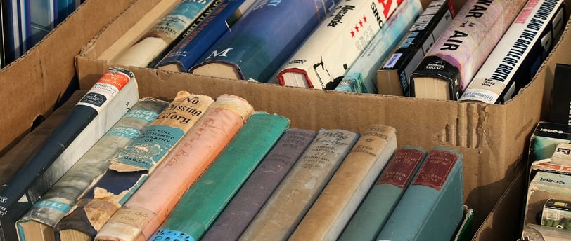 series of second-hand books in a box