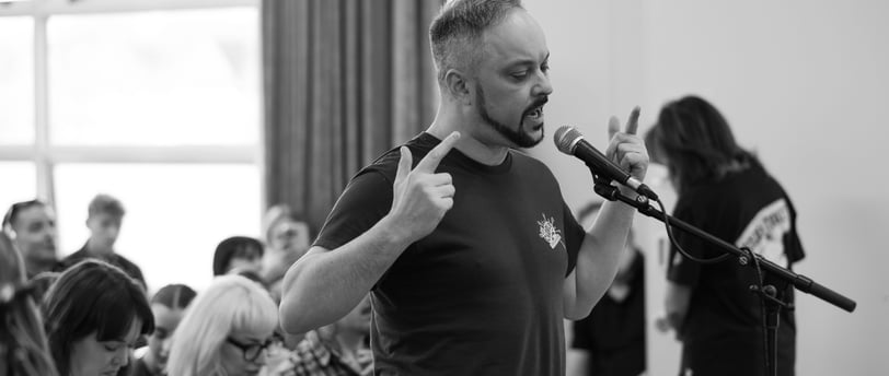 A man singing into a microphone
