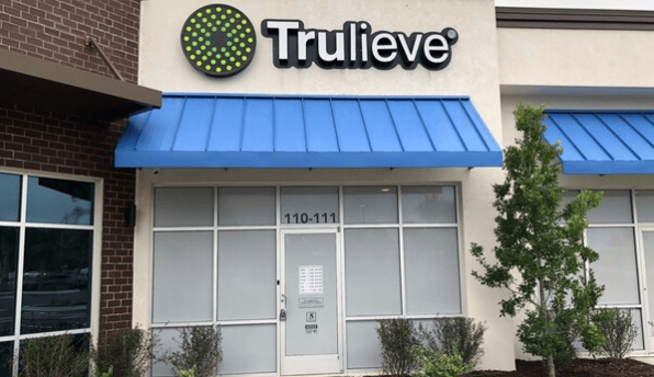 Trulieve storefront with a blue awning in Palm Coast, Florida.