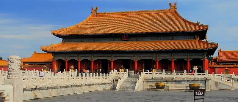 a building with a statue of a lion head on the side of it, China, Beijing,