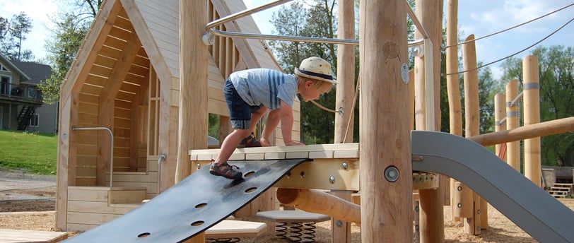 Earthscapes Play Structure with boy climbing on it