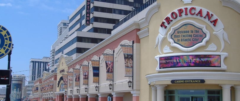 a city street scene with a clock tower in the background