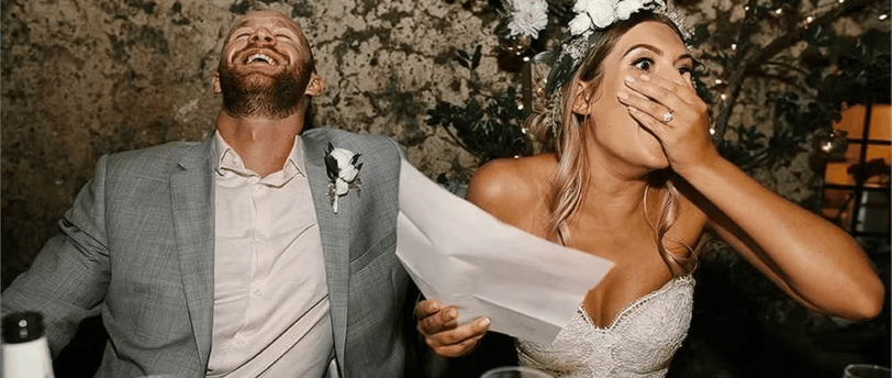 a man and woman are laughing and laughing