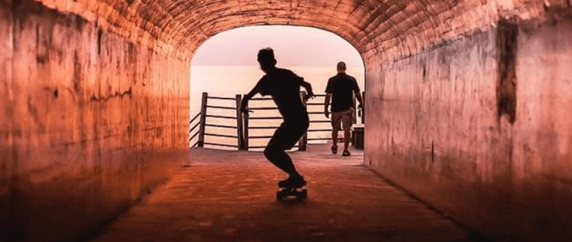 a man skateboarding down a tunnel in a tunnel in tunnel park in holland michigan