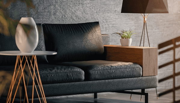 Virtually staged modern living room with black leather sofa, side table, and soft lighting