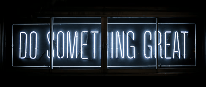 a neon sign that says do something great