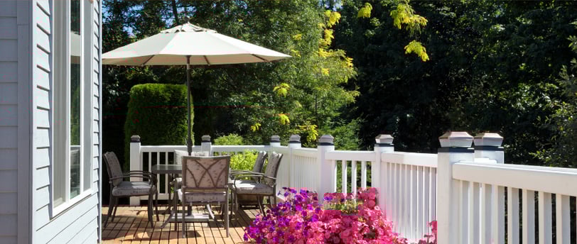 a deck with table and chairs