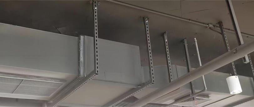 a ceiling fan with a pipe systems and strut channel support