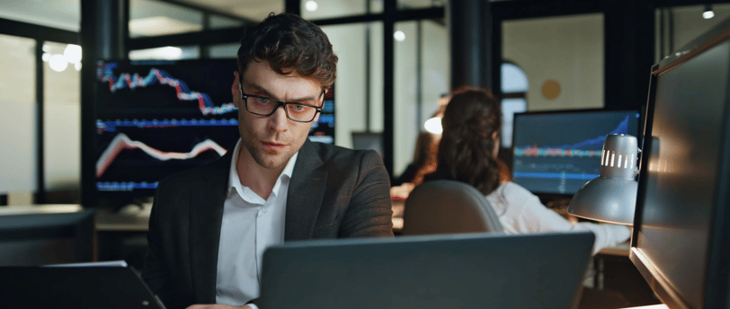 an expert investor looking at hedge fund charts and data