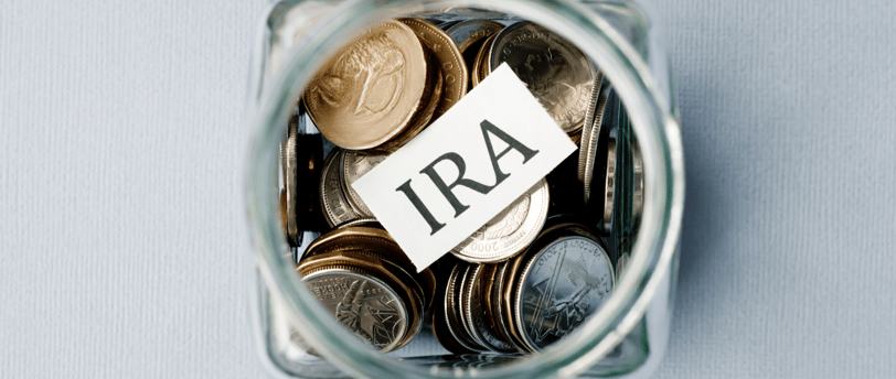 coins in a jar for an individual retirement account