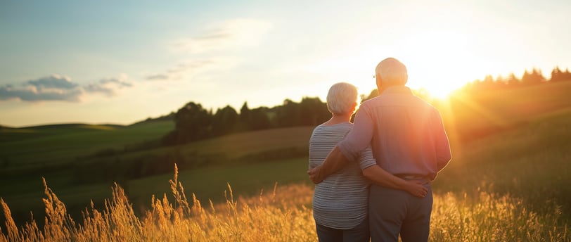 elderly couple watching the scenery and sunset with long term care insurance